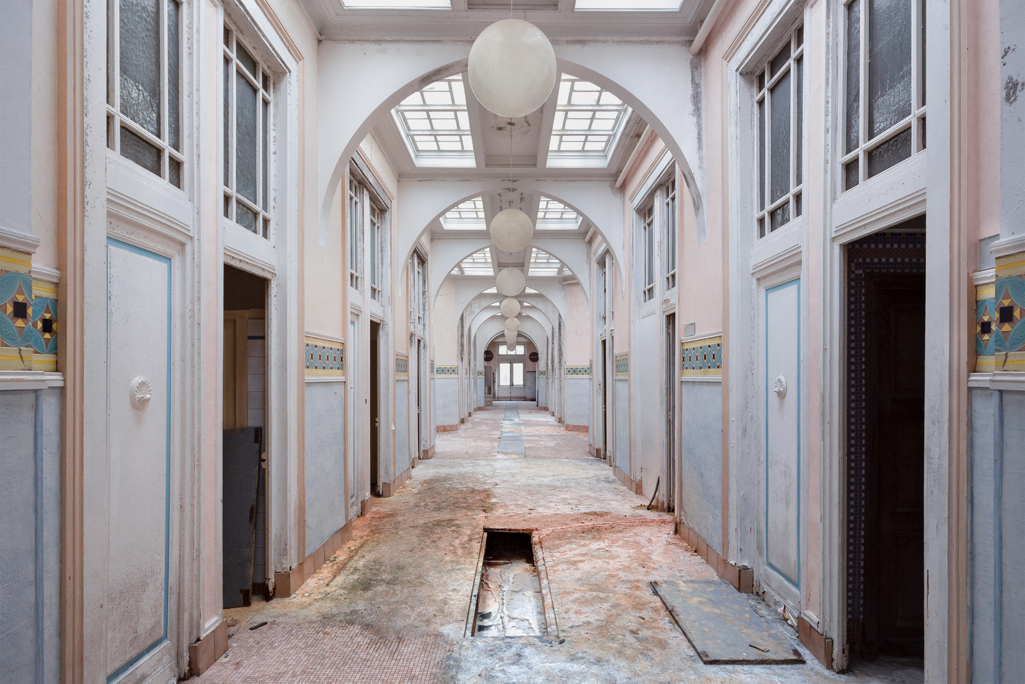Abandoned corridors inside thermal baths with grandiose architecture in France