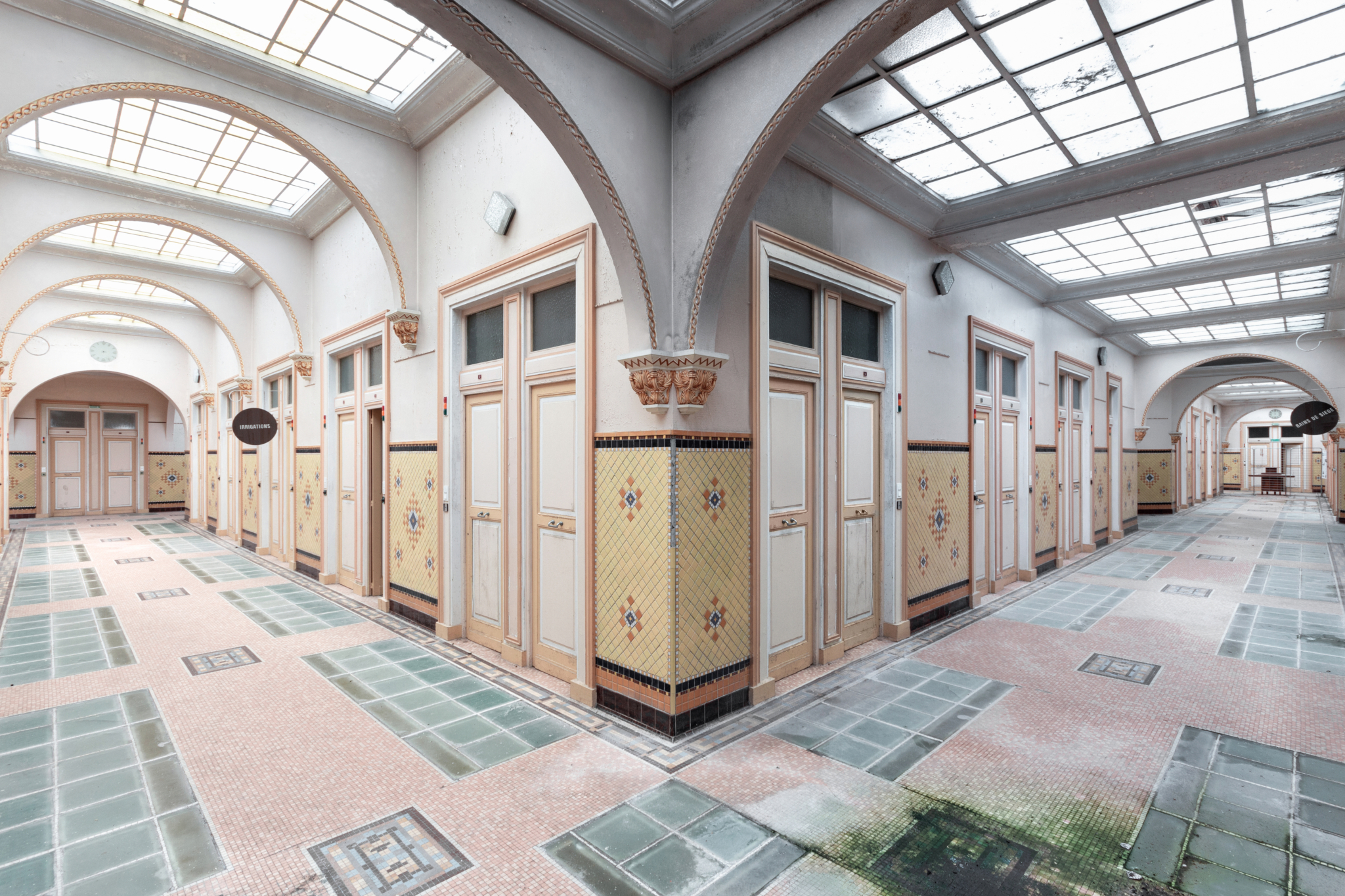 Abandoned corridors inside thermal baths with grandiose architecture in France